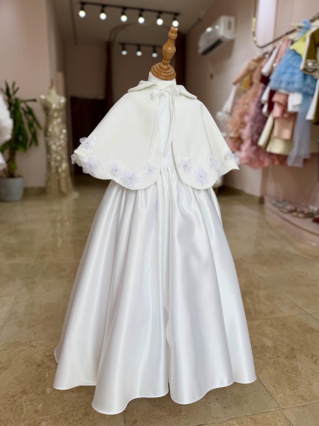 A Beautiful Handcrafted Cape Adorned with Delicate Crystals and Flora