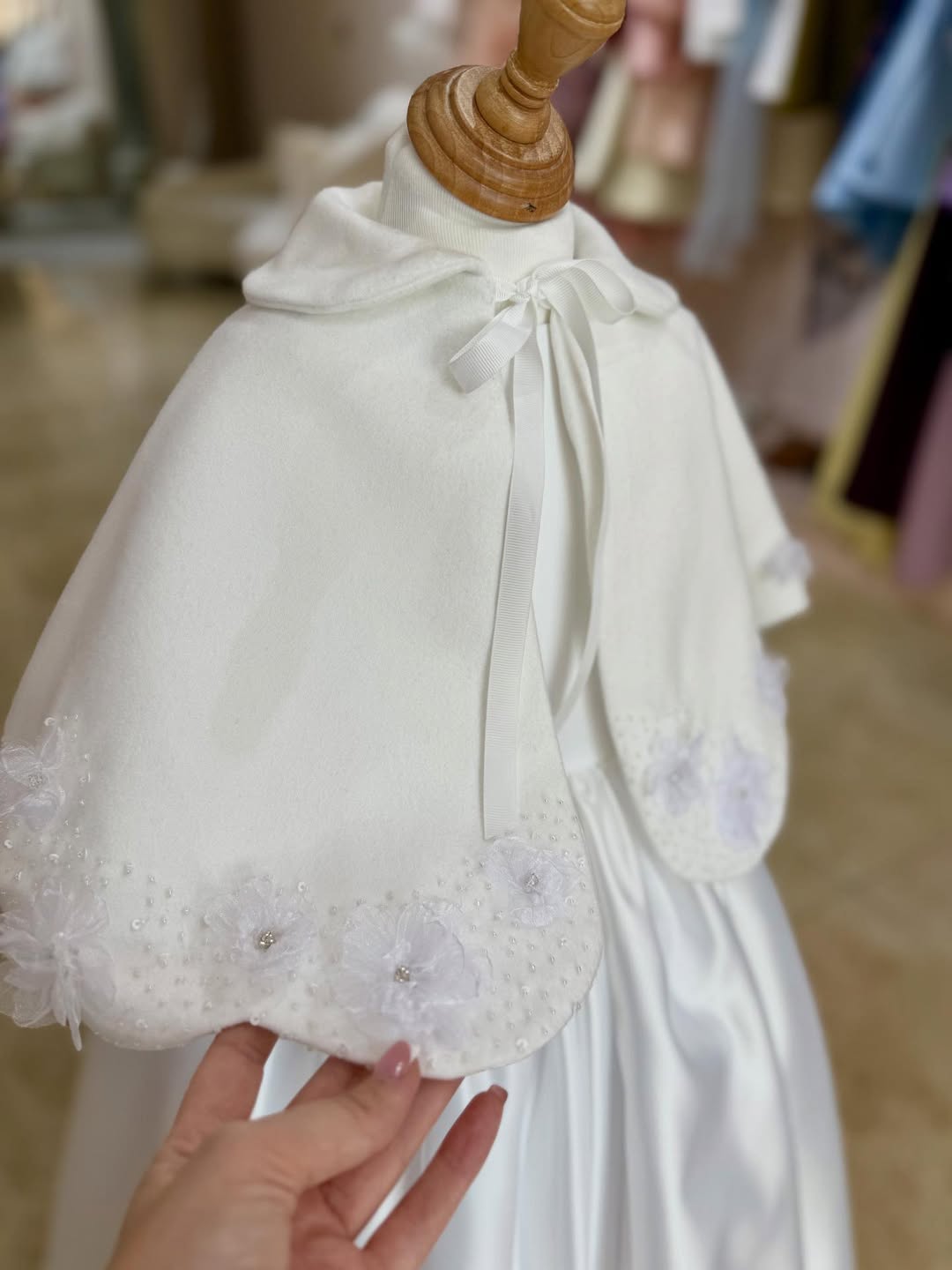 A Beautiful Handcrafted Cape Adorned with Delicate Crystals and Flora